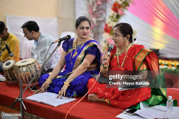 two women singers, singing a classical song, weaving an enchanting musical tale accompanied by a skilled tabla musician - indian art culture and entertainment stock pictures, royalty-free photos & images