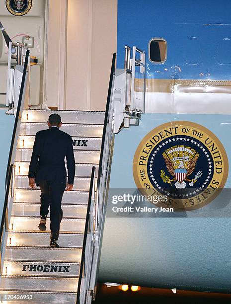 President Barack Obama boards Air Force One back to White House from Miami after attending a private DNC fundraising event. POTUS depart at Miami...