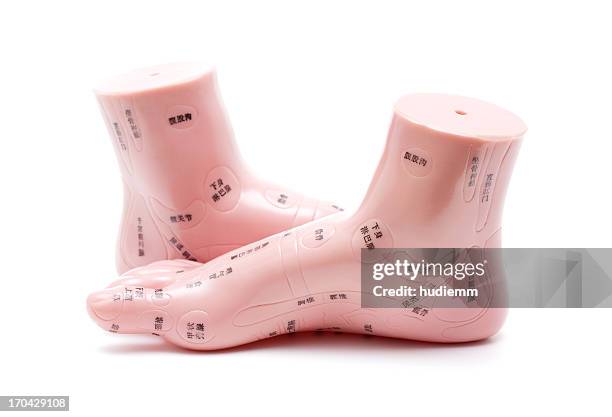 foot massage model isolated on white background - pressure point stock pictures, royalty-free photos & images