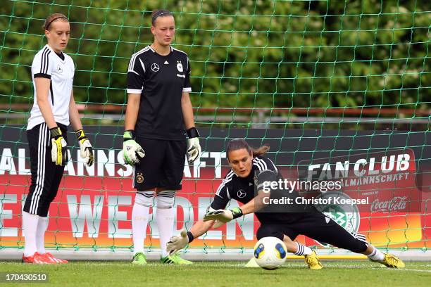 Kathrin Laengert, Laura Benkarth and Nadine Angerer attend the training session of Women's Team Germany at training ground Ueberruhr on June 13, 2013...