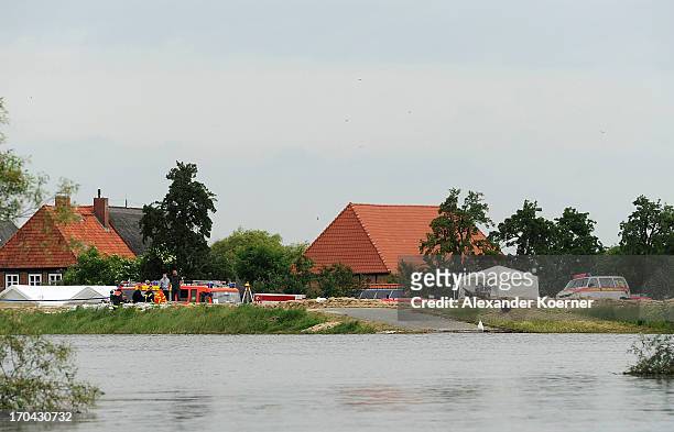 General view from a boat towards a dyke which is secured by volunteer firefighters on June 13, 2013 in Darchau, Germany. The region around Neuhausen...