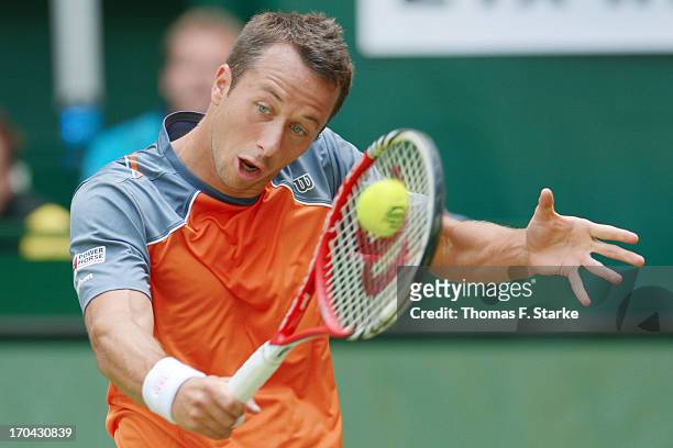 Philipp Kohlschreiber of Germany plays a backhand in his match against Tobias Kamke of Germany during day four of the Gerry Weber Open at Gerry Weber...