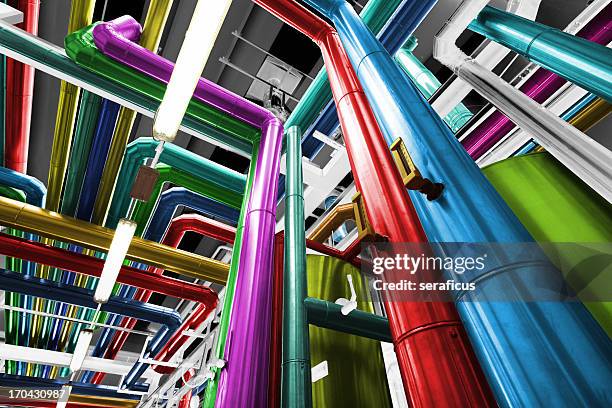 thermal power plant with its pipes brightly colored - geothermal power station stock pictures, royalty-free photos & images