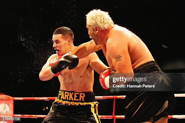 Joseph Parker of New Zealand fights Francois Botha of South Africa during the Heavyweight Title fight at Trusts Stadium on June 13, 2013 in Auckland,...