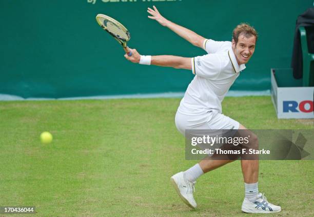 Richard Gasquet of France plays a backhand in his match against Jurgen Melzer of Austria during day four of the Gerry Weber Open at Gerry Weber...