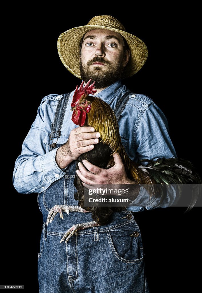 Farmer proud of his rooster