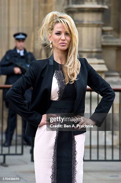 Sarah Harding poses as she makes a visit in her role as ambassador for the Coming Home charity at House of Commons on June 13, 2013 in London,...