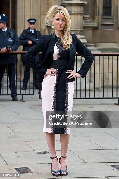 Sarah Harding poses as she makes a visit in her role as ambassador for the Coming Home charity at House of Commons on June 13, 2013 in London,...