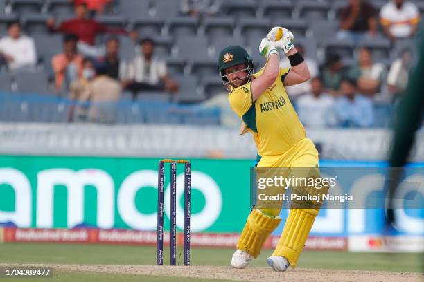 Josh Inglis of Australia plays a shot during the ICC Men's Cricket World Cup India 2023 warm up match between Pakistan and Australia at Rajiv Gandhi...