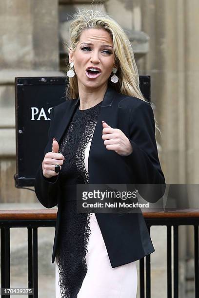 Sarah Harding poses as she makes a visit in her role as ambassador for the Coming Home charity at House of Commons on June 13, 2013 in London,...