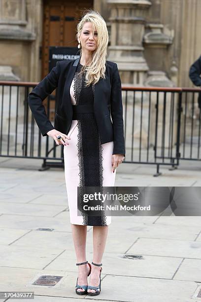 Sarah Harding poses as she makes a visit in her role as ambassador for the Coming Home charity at House of Commons on June 13, 2013 in London,...