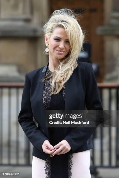 Sarah Harding poses as she makes a visit in her role as ambassador for the Coming Home charity at House of Commons on June 13, 2013 in London,...