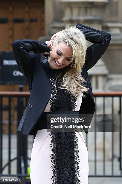 Sarah Harding poses as she makes a visit in her role as ambassador for the Coming Home charity at House of Commons on June 13, 2013 in London,...