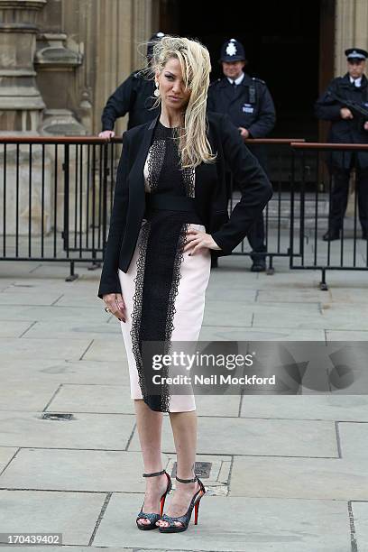 Sarah Harding poses as she makes a visit in her role as ambassador for the Coming Home charity at House of Commons on June 13, 2013 in London,...