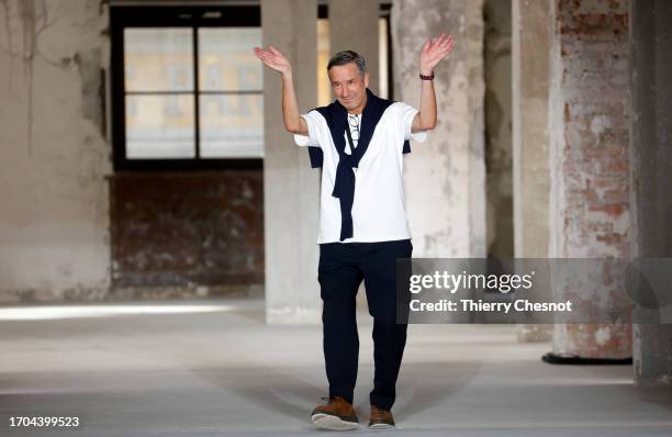 Dries Van Noten walks the runway at the end of the Dries Van Noten Womenswear Spring/Summer 2024 show as part of Paris Fashion Week on September 27,...