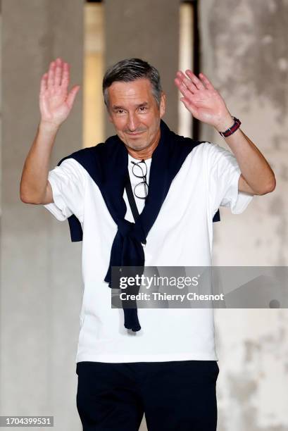 Dries Van Noten walks the runway at the end of the Dries Van Noten Womenswear Spring/Summer 2024 show as part of Paris Fashion Week on September 27,...