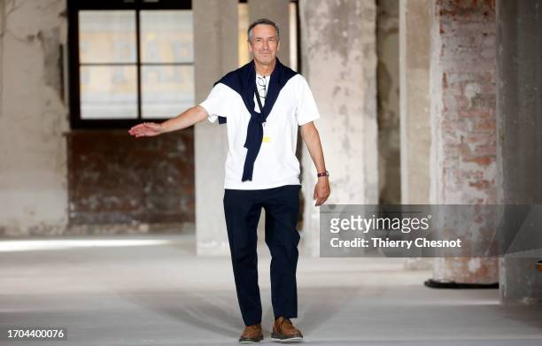 Dries Van Noten walks the runway at the end of the Dries Van Noten Womenswear Spring/Summer 2024 show as part of Paris Fashion Week on September 27,...