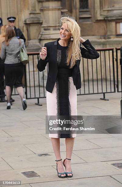 Sarah Harding poses as she makes a visit in her role as ambassador for the Coming Home charity at House of Commons on June 13, 2013 in London,...