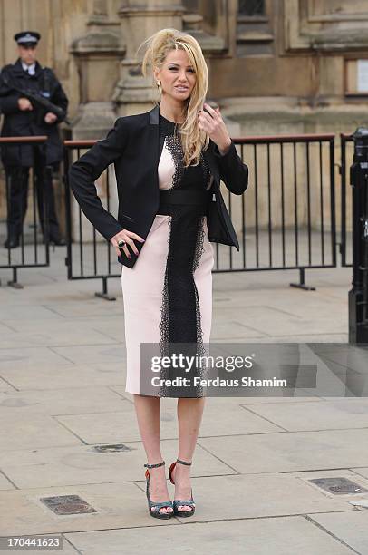 Sarah Harding poses as she makes a visit in her role as ambassador for the Coming Home charity at House of Commons on June 13, 2013 in London,...