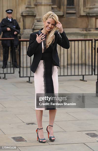 Sarah Harding poses as she makes a visit in her role as ambassador for the Coming Home charity at House of Commons on June 13, 2013 in London,...