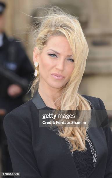 Sarah Harding poses as she makes a visit in her role as ambassador for the Coming Home charity at House of Commons on June 13, 2013 in London,...