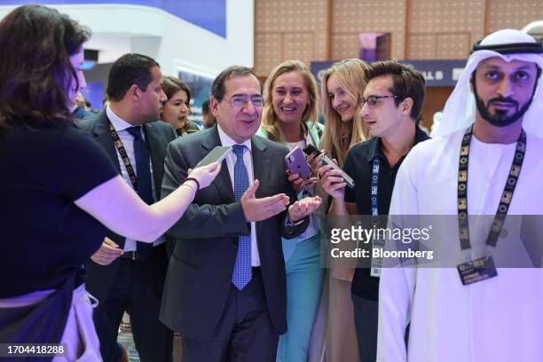 Tarek El Molla, Egypt's oil minister, center, speaks to reporters on day two of the Abu Dhabi International Petroleum Exhibition and Conference in...