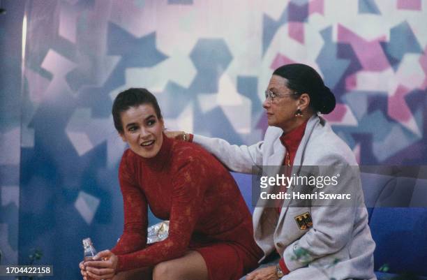 German figure skater Katarina Witt sits beside German figure skating coach Jutta Muller during the ladies' singles competition at the 1994 Winter...