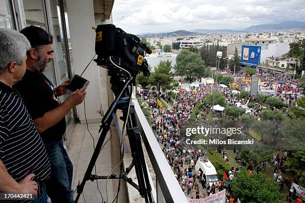 Employees of the state broadcaster ERT work during an online news bulletin broadcast at the corporation's headquarters during a 24-hour general...