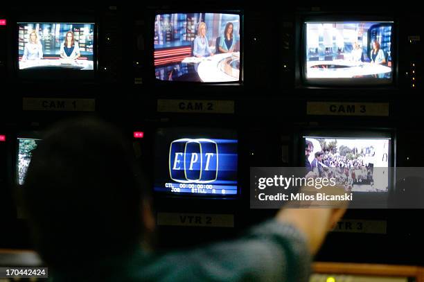 An employee of the state broadcaster ERT works in the control room during an online news bulletin broadcast at the corporation's headquarters during...