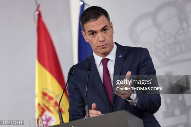 Spain's acting Prime Minister Pedro Sanchez gestures as he delivers a speech at La Moncloa Palace in Madrid on October 3, 2023 after meeting King...