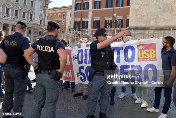 Delegation from the Basic Union demonstrates in front of Palazzo Chigi, seat of the Government, with a banner reading: hands off the right to strike,...