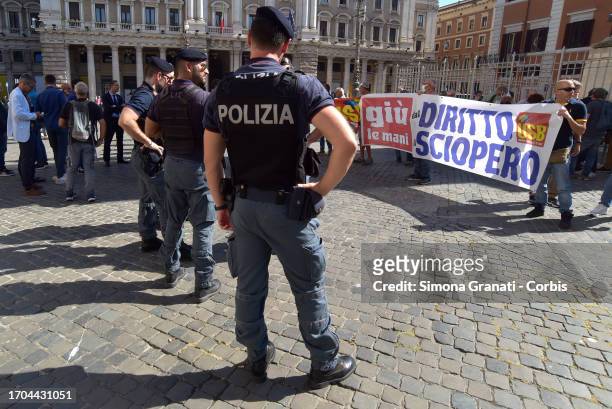 Delegation from the Basic Union demonstrates in front of Palazzo Chigi, seat of the Government, with a banner reading: hands off the right to strike,...