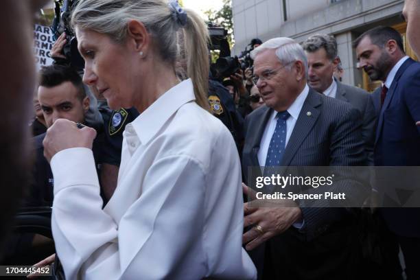 Senator Bob Menendez and his wife Nadine Menendez depart a Manhattan court after they were arraigned on federal bribery charges on September 27, 2023...