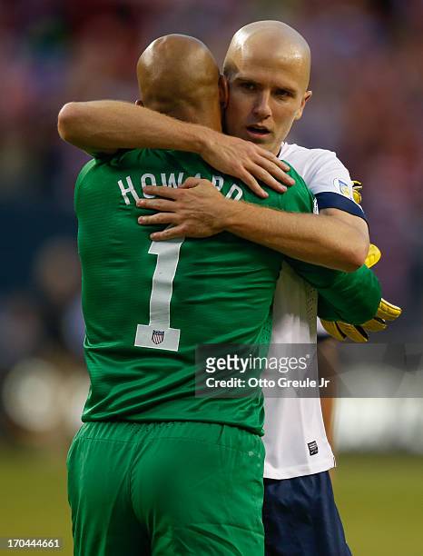 Goalkeeper Tim Howard of USA gets a hug from Michael Bradley after defeating Panama 2-0 during the FIFA 2014 World Cup Qualifier at CenturyLink Field...