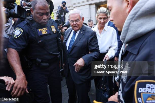 Senator Bob Menendez and his wife Nadine Menendez depart a Manhattan court after they were arraigned on federal bribery charges on September 27, 2023...