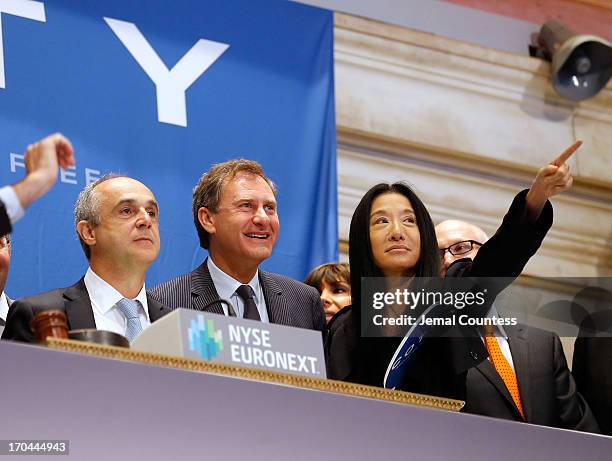 Coty CEO Michele Scannavini, President of Coty Prestige Jean Mortier and designer Vera Wang prior to the ringing of the opening bell at the New York...