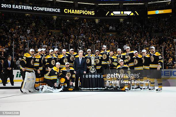 The Boston Bruins pose with the Prince Of Wales Trophy after the win against the Pittsburgh Penguins in Game Four of the Eastern Conference Final...