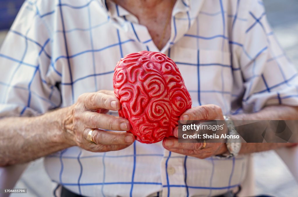 Unrecognizable old man with a plastic brain. Elderly mental health care. prevention of Dementia and alzheimer in old age