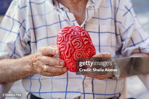 Unrecognizable old man with a plastic brain. Elderly mental health care. prevention of Dementia and alzheimer in old age Unrecognizable old man with a plastic brain. Elderly mental health care. prevention of Dementia and alzheimer in old age