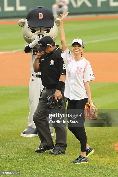 Miranda Kerr throws first pitch at Jamsil Baseball Stadium on June 13, 2013 in Seoul, South Korea.