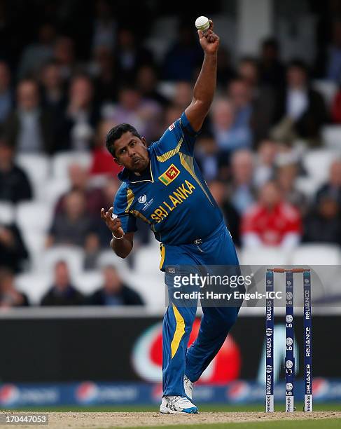 Rangana Herath of Sri Lanka bowls during the ICC Champions Trophy group A match between England and Sri Lanka at The Kia Oval on June 13, 2013 in...