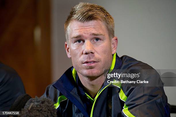 Australian cricketer David Warner talks to the press at Royal Garden Hotel on June 13, 2013 in London, England. David Warner and Captain Michael...