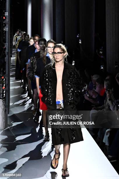 Model Gigi Hadid walks the runway with models to present creations by Miu Miu during the Paris Fashion Week Womenswear Spring/Summer 2024 in Paris on...