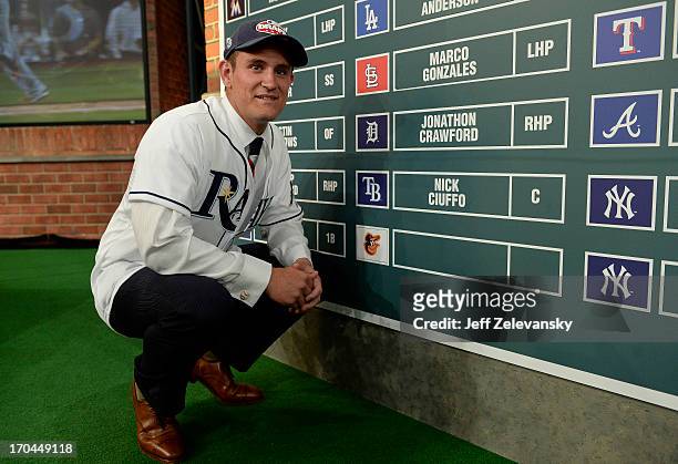 Tampa Bay Rays draftee Nick Ciuffo poses near the draft board at the 2013 MLB First-Year Player Draft at the MLB Network on June 6, 2013 in Secaucus,...