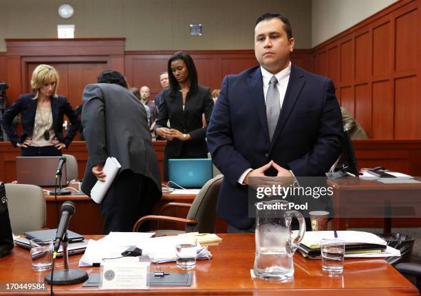 George Zimmerman stands at the start of the fourth day of his murder trial in Seminole circuit court June 13, 2013 in Sanford, Florida. Jury...