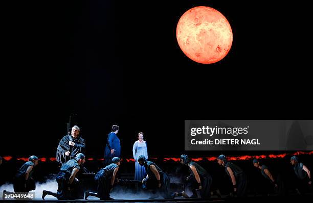 German tenor Peter Seiffert as Tristan , Swedish opera singer Nina Stemme as Isolde and German mezzo-soprano Janina Baechle as Brangaene perform in a...