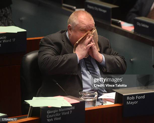 Mayor Rob Ford in Council Chambers talking to councillors about seniors and housing. Earlier today Toronto Police launched massive predawn raid, as...