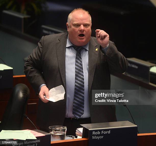 Mayor Rob Ford in Council Chambers talking to councillors about seniors and housing. Earlier today Toronto Police launched massive predawn raid, as...