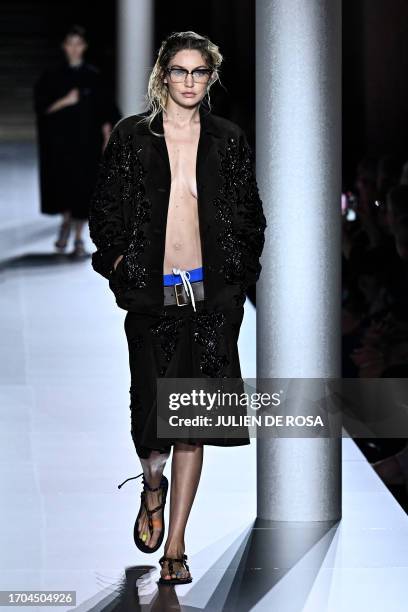 Model Gigi Hadid walks the runway with models to present creations by Miu Miu during the Paris Fashion Week Womenswear Spring/Summer 2024 in Paris on...