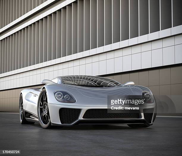 a silver sports car next to a building - supercar stock pictures, royalty-free photos & images